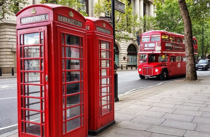 A telephone box and a double-decker bus.